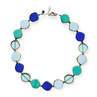 mix of blues large circle glass beaded necklace on white background