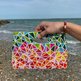 Rainbow Geometric Seed Beaded Statement Clutch and Crossbody in hand at beach