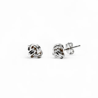 sterling silver knot shaped tiny stud earrings on white background