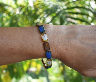 blue white ivory colored glass beaded bracelet on wrist