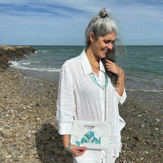 Martha's Vineyard Beaded Crossbody Clutch White Aqua Turquoise on Woman at the beach