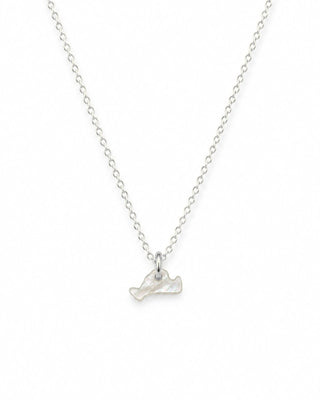 sterling silver chain with a tiny marthas vineyard island shaped pendant on a white background