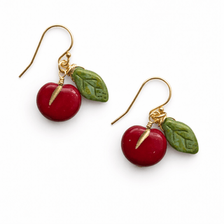 Pair of red-apple or cherry earrings with  green leaves, and 14k gold fill ear wires on a white background.