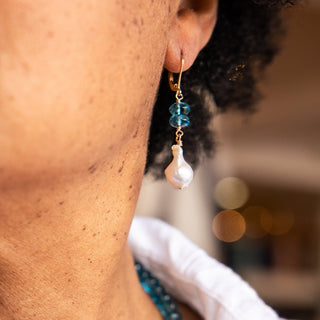 Baroque Pearl and London Blue Topaz Earrings on a woman