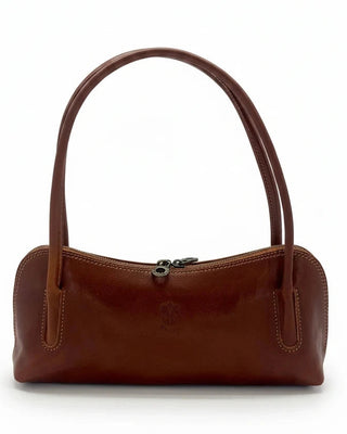 Brown leather handbag on a light gray background
