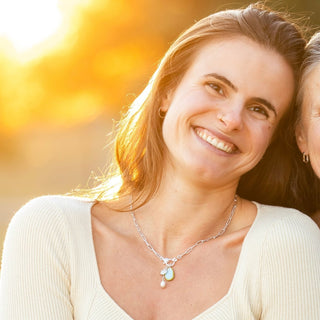 Woman wearing sterling silver charm necklace