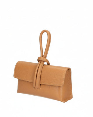 Tan handbag with a knot detail on a white background
