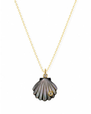 Shell-shaped pendant necklace with gold chain on a white background