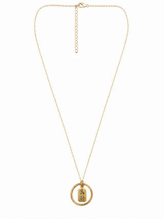 A gold chain necklace featuring a brass ring pendant with a small rectangular charm engraved with FREE RIDE ticket to the flying horses carousel in Oak Bluffs Marthas Vineyard
