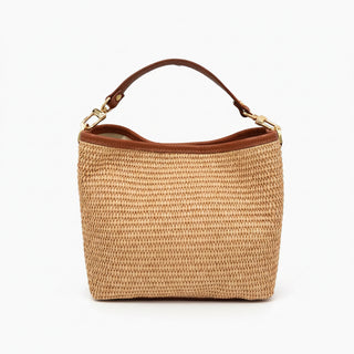 Woven handbag with brown handle and trim on a white background