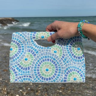 Seaglass Beaded Statement Crossbody Clutch in hand at beach 