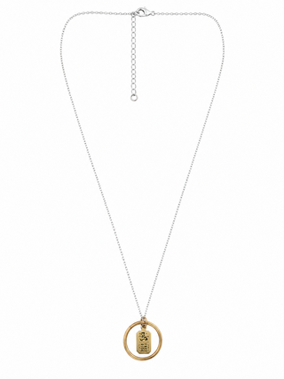 A delicate silver chain necklace with a double-ring pendant in gold, featuring a brass ring charm engraved with a FREE RIDE ticket to the flying horses carousel on Martha's Vineyard

