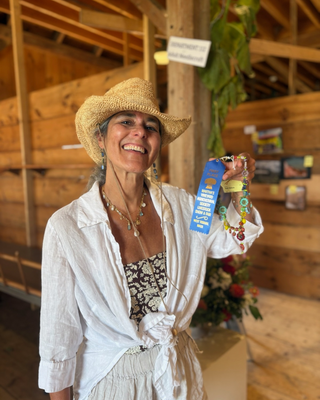 Stefanie Wolf holding a 1st place handmade necklace at the Martha's Vineyard Agricultural Fair
