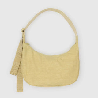 Yellow shoulder bag with a strap on a white background