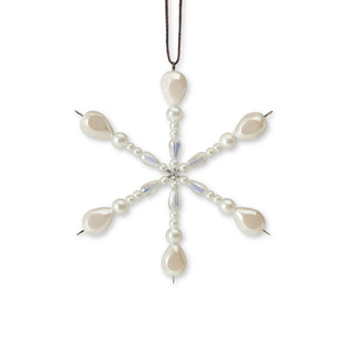 white pearl shell, mother of pearl, beaded handmade snowflake ornament on a white background