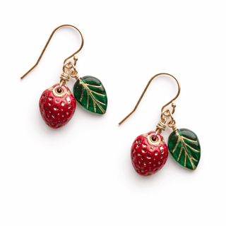 Strawberry-themed earrings with red strawberries and green leaves on a white background