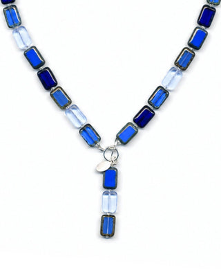 royal blue glass beaded necklace on white background