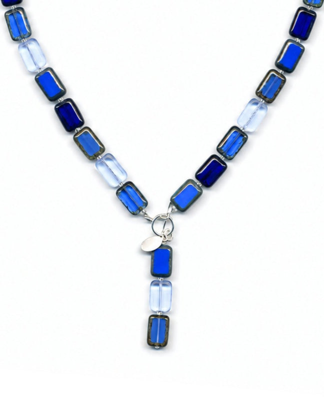 royal blue glass beaded necklace on white background