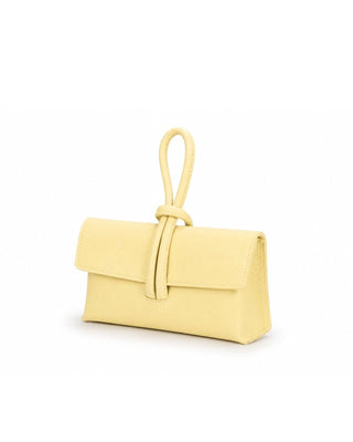 Yellow clutch bag on a white background