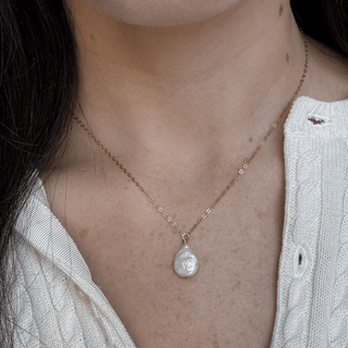 Coin pearl necklace on gold